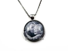 Put your favorite photo gorgeous round glass dome necklace. Choose from 4 metal finishes and as a necklace or key chain. Your custom photo is fused to a thick glass bevel inside of a round pendant tray. Comes with a matching 24 inch ball chain or link chain with lobster clasp (can be shortened upon request). Key chain option is also available - make your selection from the drop down menu. After ordering, please convo us and attach your photo, or you can email to littlegemgirl@hotmail.com, please Nickel-free Charm Necklaces For Keepsake, Silver Round Charm Necklace For Memorial, Nickel-free Round Pendant Charm Necklace For Her, Stainless Steel Charm Necklace With Round Pendant, Stainless Steel Round Pendant Charm Necklace, Round Pendant Charm Necklace For Mom, Nickel Free Round Charm Necklace For Gift, Nickel Free Round Charm Necklaces For Gifts, Nickel-free Round Charm Necklaces For Gifts