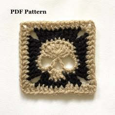 a crocheted square with a skull in the center and text that reads,'free pattern '