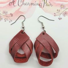 These charming deep red leather twist earrings are 1-1/2  inch long.  That is the length of the leather. Please see photos for the overall length.  They are the perfect size to enhance your outfit without being to bold. They are lightweight, you will forget that you are wearing them. I would suggest keeping them out of water. Leather tends to get spotted and can shrink.  They are suited for sensitive ears.  **USUALLY SHIPS NEXT DAY  *Nickle free hooks  PLEASE SEE PHOTOS FOR TOTAL LENGTH. GET COMPLIMENTS 😎 They look good with casual clothes, work clothes or a night out on the town with jeans and a shirt. They are subtle beauties. I'm sure you will get plenty of compliments! They also make great  gifts for someone special like your Bestie, Mom, daughter Aunt co-worker. You get the picture. Twist Earrings, Clear Bags, Sensitive Ears, Leather Earrings, Favorite Dress, You Are Awesome, Jump Rings, Deep Red, Fun Workouts