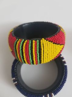 This cool bracelet is made of beads and leather. It hugs comfortably at the wrist. The bracelet has been neatly crafted with love and focus. Every bead placed one by one with accuracy for a great finish. You can ask to personalize this bracelet with your own colors or even name. Thanks for visiting my shop. Come again. Stay safe. https://www.etsy.com/shop/naistumityujewelry Wrist Bracelet, Purple Gift, Beaded Collar, African Beads, Leather Bracelets, Savannah Ga, Seed Bead Jewelry, Stay Safe, Charm Bracelets