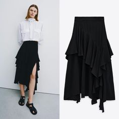 High-Waisted Midi Skirt. Tonal Matching Ruffles. Asymmetric Hem. Back Hidden In-Seam Zip Closure. Chic Stretch Midi Draped Skirt, Chic Stretch Draped Midi Skirt, Chic Draped Midi Skirt With Stretch, Chic High-waist Ruffled Maxi Skirt, Chic High Waist Ruffled Maxi Skirt, Spring Black Fitted Draped Skirt, Spring Midi Draped Skirt For Night Out, Spring Draped Midi Skirt For Night Out, High Waist Ruffled Skirt For Fall