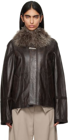 Buffed sheepskin jacket. · Paneled construction · Shearling trim at spread collar · Zip closure with concealed button placket · Detachable tie bar at placket · Welt pockets · Detachable logo flag at back · Patch pocket at interior · Stripes at full satin lining Supplier color: Brown Ader Error, Sheepskin Jacket, Aviator Jackets, Fringe Jacket, Tie Bar, Brown Leather Jacket, Button Placket, Welt Pockets, Outerwear Jackets