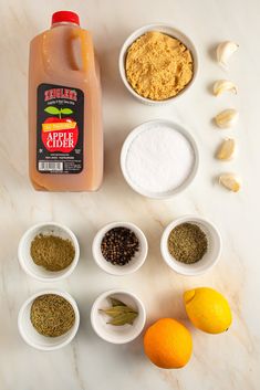 the ingredients to make an apple cider are arranged in small bowls