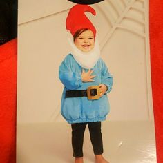 a card with an image of a child wearing a gnome costume