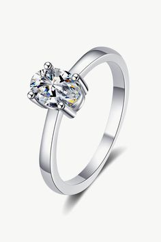 Best Diamond Ring Jewelry Gifts for Women | 1 Carat Oval Diamond Ring - Sunset Days | MASON New York Diamond White Oval Solitaire Ring, Oval Solitaire Diamond Ring For Formal Occasions, Formal Oval Solitaire Diamond Ring, Classic Silver Oval Diamond Ring, Classic Open Diamond Ring With Halo Design, Classic Diamond Open Ring With Halo Design, Classic Open Crystal Ring, Halo Design Diamond Ring With Round Band, Classic White Crystal Ring