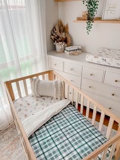 a baby's crib in the corner of a room