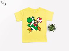 a t - shirt with an image of mario and mushroom on it