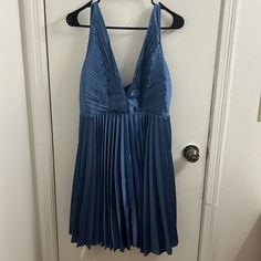 Never Worn. Still Has Tags. Size Medium Pleated Falls Above Kneecap. Blue V-neck Dress With Pleated Bodice, Blue Knee-length Midi Dress With Pleated Bodice, Blue Pleated Bodice Knee-length Midi Dress, Blue Midi-length Pleated Dress For Spring, Blue Pleated Midi Dress For Spring, Blue V-neck Pleated Mini Dress, Chic Blue A-line Pleated Dress, Blue Pleated Party Dress, Fitted Blue Pleated Dress For Evening