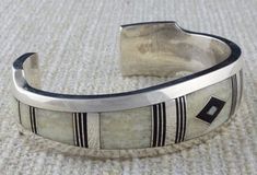 White Rectangular Wedding Bracelets, Luxury Silver Jewelry With Inlay, Modern White Bangle For Formal Occasion, Classic White Rectangular Bracelets, Modern White Rectangular Bracelet, White Rectangular Jewelry With Polished Finish, Rectangular White Jewelry With Polished Finish, Elegant Handmade Bone-colored Jewelry, White Engraved Bracelets For Weddings