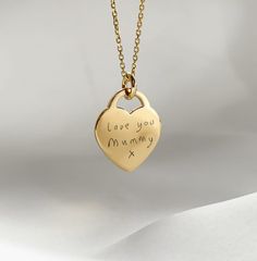 "Our yellow gold handwriting heart necklace makes a heartfelt gift ♥ Our beautiful range of engraved handwriting jewellery makes a beautiful dedication to a loved one's memory, all it takes is a photo of their handwriting for our engraving team to work from. This yellow gold vermeil heart charm measures 16mm across the front of the heart and is the largest of our engravable charms, ideal for engraving several names, a longer message or to achieve a larger scale of engraved handwriting. The heart Meaningful Gold Necklace With Heart Charm, Hand Stamped Heart Pendant Necklace For Keepsake, Gold Necklace With Heart Charm, Meaningful Style, Keepsake Hand Stamped Heart Pendant Necklace, Keepsake Hand-stamped Heart Pendant Necklace, Heart-shaped Engraved Name Necklace For Mom, Engraved Heart Charm Necklaces For Mom, Engraved Heart Charm Necklace For Mom, Mother's Day Yellow Gold Name Necklace With Heart Charm