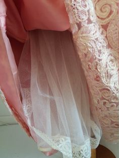 "Rare and So beautiful , the detail is amazing. Early 1950s in beige lace over and pink silk taffeta underdress ball gown with boned strapless bodice ,fitted waist, large pink bow at the back and metal zip closure. ✂-----Measurements : fits like: small length:54\" bust:34\" waist: 29'' hips: free material : lace ,silk taffeta brand/maker: Sidenhust condition: excellent ( very faint discoloration at the hem ) Shipping Is Avaliable Worldwide. Every item is carefully shipped Priority via Air Mail - Pink Lace Ball Gown With Lace Bodice, Victorian Lace Ball Gown With Fitted Bodice, Vintage Full Skirt Wedding Dresses, Victorian Lace Wedding Dress In Marie Antoinette Style, Lace Gown With Lace Trim For Debutante Ball, Vintage Events Boned Bodice Ball Gown, Vintage Ball Gown With Boned Bodice For Events, Ball Gown With Boned Bodice For Vintage Events, Vintage Pink Petticoat For Party