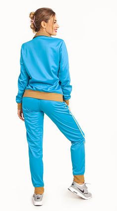 This women's 2-piece tracksuit features a comfortable track material suitable for any age and all sorts of casual and sports activities. Tracksuits have always been in mainstream fashion trends and the elegant color combinations has made this 2-piece tracksuit a top choice for every day activewear. Many traditional outlets do carry trimmed jogger track pants with full zip up track jackets but not many carry a matching 2-piece jogging outfit. This matching 2-piece jogging outfit is available in r Athleisure Tracksuit With Elastic Waistband And Long Sleeve, Athleisure Tracksuit With Elastic Waistband, Fall Tracksuit With Elastic Waistband, Sporty Tracksuit With Elastic Waistband For Leisure, Sporty Stretch Tracksuit With Pockets, Sporty Leisure Tracksuit With Elastic Waistband, Winter Sporty Tracksuit With Elastic Waistband, Sportswear Sets With Pockets For Sports, Sporty Stretch Tracksuit For Leisure