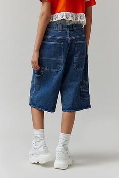 BDG Astrid denim jorts designed in a super baggy jorts silhouette with a low rise and a wide leg that hits below the knee. Find these BDG denim shorts only at Urban Outfitters. Features BDG Astrid baggy jorts Longline denim shorts Low-rise waistline Cargo pockets down the legs Oversized back pockets with BDG embroidery Relaxed wide-leg fit Cropped knee length 5-pocket styling Zip fly and button closure UO exclusive Content + Care 80% Cotton, 20% recycled cotton Machine wash Imported Size + Fit M Long Shorts Outfits Street Style, Long Jean Shorts, Long Denim Shorts, Outfit Art, Skater Outfits, Denim Shorts Outfit, Denim Jorts, Urban Outfitters Shorts, Low Rise Shorts