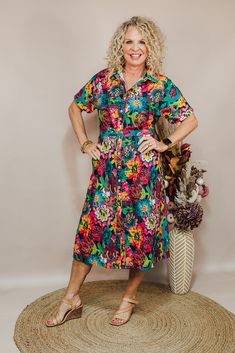 Dresses are a girl's best friend! The Vanessa Dress is a floral button-down midi dress in a floral print with a tie around the waist. Pair with heels or sneaker for whatever look your going for! Available in Sizes: X-Small, Small, Medium, Large, X-Large, 2X Michaelle is wearing a X-Small Fabric: 100% Polyester Fit: You Can Usually Size Down In Layerz Clothing Brand: Layerz Clothing Spring Printed Button-up Dresses, Casual Multicolor Tropical Print Midi Dress, Casual Multicolor Midi Dress With Tropical Print, Spring Floral Print Shirt Dress For Beach, Casual Tropical Print Floral Dress For Day Out, Casual Floral Dress With Tropical Print For Day Out, Floral Print Shirt Dress For Spring Beach Outings, Floral Print Shirt Dress For Spring Beach, Summer Vacation Floral Print Shirt Dress