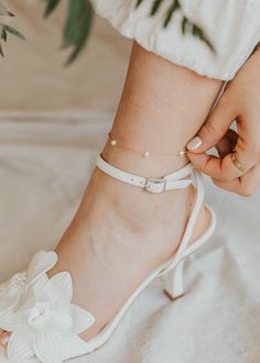 We are head over ankles for pearls! This cable pearl anklet is adorned with the most preciously placed pearls making for a dreamy ethereal feel. A summer must-have. Choose from two sizes: 8.5"-9" and 9.5"-10". Available in 14kt Gold Fill + Sterling Silver. Shown with our Stella Anklet. Handmade in Eau Claire, WI. Our jewelry is handmade so each piece will be unique and may vary slightly from what is pictured. Elegant Pearl Anklets For Party, Elegant Pearl Chain Anklet For Party, Delicate Pearl Chain Anklets, Adjustable White Pearl Anklets, Adjustable Minimalist Pearl Chain Anklet, Adjustable Pearl Chain Anklets, Dainty Adjustable Anklets For Wedding, Elegant Pearl Anklets With Pearl Chain, Adjustable Dainty Pearl Anklets