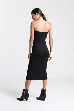 When sleek is spectacular. Our strapless midi Natalia Dress is the versatile LBD you’ve been waiting for. Our soft, structured and mid-stretch European ponte fabric gives her a slight sheen and a smoothing fit, while her sleek silhouette makes Natalia effortless to dress up or down. Wear her to date-night cocktails just as easily as you might to run around the corner - Natalia will go everywhere with you.[SPLIT] Sam is 5'8" (173 cm) tall, wearing size XS. Total length approximately 38" (95 cm). Black Midi, Around The Corner, Fitted Dress, Dress Making, One Shoulder Formal Dress, Date Night, Split, Cocktail Dress, Black Dress