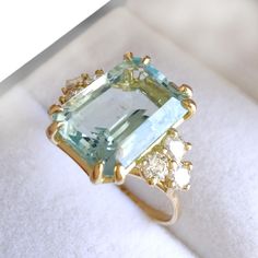 Free Shipping to the U.S. & 100% of Tax, VAT, and Customs Fees Included in the Price. Exquisite 18K Solid Gold Aquamarine Diamond Ring with Octagon Cut, perfect as a March Birthstone gift for her. Elegant blue gemstone jewelry Ring Size: 6.75 US, Resizable Total Weight: 4.06 g Main Gemstone Stone Type: Aquamarine Cut: Emerald Quantity: 1 Dimensions: 0.472 x 0.346 x 0.236 inches (12 x 8.79 x 6 mm) Total Carat Weight: 5,3 ct Secondary Gemstones (Diamonds) Diamonds (4 stones): Cut: Round Brilliant Blue Octagon Emerald Ring With Accent Stones, Blue Emerald Rings With Gemstone Accents, Emerald Cut Aquamarine Rings With Gemstone Accents, Fine Jewelry Aquamarine Octagon Ring, Fine Jewelry Aquamarine Ring In Octagon Shape, Fine Jewelry Aquamarine Diamond Ring With Gemstone, Octagon Aquamarine Gemstone Rings, Aquamarine Gemstone Octagon Rings, Blue Emerald Gemstone Ring