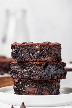 three chocolate brownies stacked on top of each other