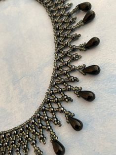 Elegant Black Necklace With Dangling Beads, Black Beaded Necklaces With Bead Caps As Gift, Black Round Beads With Bead Caps, Adjustable Black Jewelry With Bead Caps, Elegant Beaded Drop Necklace, Black Beaded Choker For Jewelry Making, Elegant Drop Beaded Necklace, Black Beaded Dangle Necklace, Black Dangle Beaded Necklace For Party