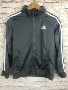 Youth Adidas Jogger Jacket.  Zip-up front jacket with pockets.  Gray with white stripes down sleeves.  Youth Medium 10-12 Gray Winter Long Sleeve Track Jacket, Adidas Winter Track Jacket With Ribbed Cuffs, Adidas Long Sleeve Track Jacket For Spring, Adidas Long Sleeve Winter Track Jacket, Adidas Winter Track Jacket Long Sleeve, Adidas Long Sleeve Spring Track Jacket, Adidas Winter Track Jacket Sportswear, Adidas Stretch Long Sleeve Tops, Fall Sportswear Track Jacket With Long Sleeves