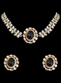 Buy a contemporary Indian bridal set with a Kundan and Black stones setting. Glamorous choker necklace paired with earrings. This jewelry set includes necklace & earrings. Modern Indian Bridal Jewelry now available near Bay Area, California, USA. Shipping worldwide! Elegant Kundan Choker Necklace For Ceremonial Occasion, Elegant Black Kundan Jewelry, Elegant Black Kundan Necklace, Elegant Festive Ceremonial Choker, Black Kundan Jewelry For Festive Occasions, Elegant Hand Set Choker For Ceremonial Use, Elegant Hand Set Choker For Ceremonial Occasions, Black Temple Jewelry For Ceremonial Occasions, Elegant Ceremonial Hand Set Choker