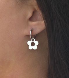 Earring size: 1.1'' x 0.6'' or 27mm x 15.2mm Hoop size: 16mm Flower size: 15.2mm Description: Simple and minimal daisy flower hoop earrings in gold or silver plated stainless steel. Stainless steel is a very durable and strong metal and is considered very high quality for jewelry. It has a very sleek appearance and is a good choice for casual and everyday wear.  Check out my shop for more items: https://www.etsy.com/shop/TenthRealmJewelry Message me with any questions or concerns you may have, I Dainty Hoop Earrings With Flower Charm, Minimalist Flower Shaped Pierced Jewelry, Everyday Flower Charm Hoop Earrings, Small Hoop Jewelry With Flower Charm For Everyday, Everyday Small Hoop Jewelry With Flower Charm, Everyday Flower Hoop Earrings, Everyday Flower Shaped Hoop Earrings, Dainty Flower-shaped Hypoallergenic Hoop Earrings, Dainty Hypoallergenic Flower Hoop Earrings