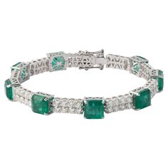 This is a stunning natural Zambian Emerald bracelet which has Emerald of very high quality and diamonds of very good quality . it has vsi clarity and G colour. Emerald : 14.76 cts diamonds : 4.74 cts gold : 14.95 gms Its very hard to capture the true color and luster of the stone, I have tried to add pictures which are taken professionally and by me from my I phone to reflect the true image of the item. It's an Estate piece so all measurements and Weight of the stone are approximate. Please read Emerald Bracelets, 1st Dibs, Add Pictures, Bracelet Tennis, Emerald Bracelet, Zambian Emerald, I Phone, Zambia, Emerald Diamond