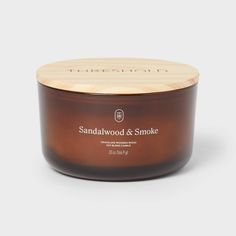 Fill your space with the warm essence of sandalwood and smoke using the 3-Wick Amber Glass Wooden Wick Sandalwood and Smoke Jar Candle 20oz from Threshold™. Housed in a sleek amber glass jar, this 20oz candle comes with three crackling wooden wicks that emit the vibe of a relaxing fireplace. The soy and paraffin wax blend offers approximately 51 hours of burn time, making this candle ideal for cozying up your evenings and setting an inviting mood. Threshold™: Looks like home, feels like you. Cozy Candles, Amber Glass Jars, Wood Candle, Glass Jar Candles, Candle Flames, Wooden Wick, Wood Candles, Tin Candles, Jar Candle