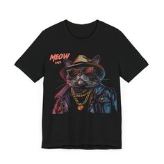 Step up your game with the "Swag Cat Tee - 'Meow Papi' Edition," the ultimate t-shirt for feline fans who appreciate a blend of humor and style. This shirt features a slick cat decked out in the coolest fashion: a fedora, shades, and a gold chain—pure meow magnificence. It's not just a t-shirt; it's a statement that says you're bold, confident, and ready to take on the world with the same charisma as 'Meow Papi' himself. Whether you're lounging or out on the prowl, make a statement that's imposs Trendy Streetwear T-shirt With Cat Design, Cat Design Short Sleeve Top For Streetwear, Short Sleeve Cat Design Top For Streetwear, Short Sleeve Tops With Cat Design For Streetwear, Cat Design Short Sleeve T-shirt For Streetwear, Streetwear Crew Neck Top With Cat Design, Cat Print Crew Neck T-shirt For Streetwear, Graphic Tee With Cat Print For Streetwear, Black Gamer T-shirt For Streetwear