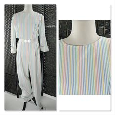 "Vintage Handmade 80s Jumpsuit, Pastel Stripe Seersucker, High Rise, Tapered leg This unique piece is handmade of a crisp seersucker fabric. It is in excellent condition. The belt is slightly off center, and it would probably hang better if shoulder pads were added. There is a substantial back flap to tuck in.  No size tag. Estimated large to extra large.  Vintage sizes can be very different from today's sizes. For best fit, please compare the measurements below to a similar item from your own c Vintage White Jumpsuits And Rompers For Spring, Summer Vintage Long Sleeve Jumpsuits And Rompers, 80s Jumpsuit, Seersucker Fabric, Womens Jumpsuits, Pastel Stripes, Tapered Legs, Jumpsuits For Women, Unique Pieces