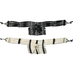 Bone chokers were a part of Native American culture in almost every part of the Americas and were worn as ornamentation and for protection. Bone choker styles varied from tribe to tribe. This Indian replica jewelry is crafted with natural leather, bone, glass and metal beads, feathers, sinew and stainless wire. Great for native apparel, costumes, and black powder use. Sold individually in assorted colors. Colors and designs will vary. Styles available (see photos): A. 10 Strand Choker B. 4 Stran Bone Choker, Replica Jewelry, Leather Choker Necklace, Native Style, American Culture, Native American Culture, Bone Beads, Choker Style, Choker Necklaces