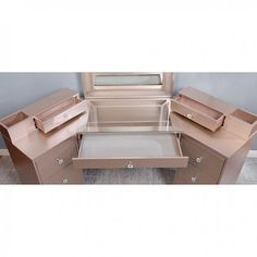 an image of a vanity with drawers on the bottom and one drawer open to show it's contents