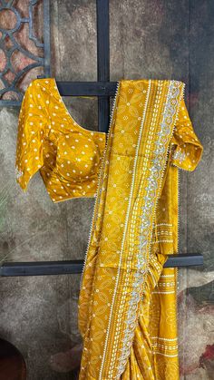 Mustard yellow modal silk saree with gotta work border, stitched blouse Yellow Mirror Work Sets In Dola Silk, Yellow Dola Silk Set With Mirror Work, Yellow Chanderi Choli With Traditional Drape, Designer Yellow Chanderi Choli, Yellow Chinon Sets With Zari Work, Yellow Sets With Mirror Work In Traditional Drape, Traditional Drape Yellow Chanderi Choli, Yellow Saree Set With Zari Work, Yellow Traditional Drape Sets With Mirror Work