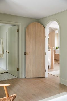 an open door leading to a bathroom and bedroom