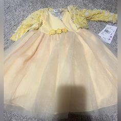 Yellow New Baby Girl Dress. Size 12 Months Long Sleeve Tutu Dress For Spring Dress-up, Long Sleeve Tutu Dress For Dress-up In Spring, Cute Long Sleeve Princess Dress For Baptism, Long Sleeve Princess Dress For First Birthday, Princess Style Long Sleeve Dress For First Birthday, Spring Long Sleeve Ruffled Tutu Dress, Spring Baptism Long Sleeve Tutu Dress, Cute Long Sleeve Dresses For First Birthday, Cute Long Sleeve Baptism Dress