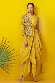 Yellow cowl draped dress with floral embroidered border. Paired with one sided scallop hem floral embroidered jacket.
Component: 2
Embroidered
Neckine: Round
Sleeve Length: Sleeveless
Fabric: Silk Cotton
Color: Yellow
Side tassel tie-up
Closure: Side zip
 - Aza Fashions Yellow Haldi Outfit, Cowl Drape Dress, Drape Sari, Indo Western Outfits For Women, Haldi Dress, Haldi Outfits, Haldi Outfit, Draping Fashion, Indo Western Dress