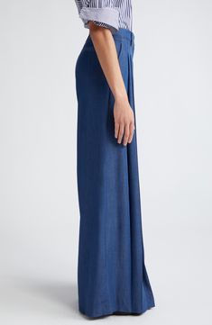 Crisp pleats lend tailored structure to otherwise breezy pants cut in a wide-leg silhouette that brings runway-worthy movement to every step you take. 34" inseam; 33" leg opening; 11 1/2" front rise; 16" back rise (size 6)   Zip fly with hook-and-bar closure   Front slant pockets; back welt pocket   100% Tencel® lyocell   Tencel lyocell is a sustainably produced fiber made with closed-loop processing   Machine wash, dry flat   Made in the USA of imported fabric Spring Pleated Wide Leg Pants, Elegant Wide Leg Pants With Side Slits, Pleated Wide-leg Pants, Elegant Wide-leg Pants With Side Slits, Pleated Wide Leg Bottoms With Relaxed Fit, Spring Wide-leg Pants With Side Slits, Fitted Wide-leg Pants With Side Slits, Spring Wide Leg Pants With Side Slits, Casual Wide Leg Pants With Side Slits