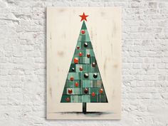 a painting of a christmas tree on a white brick wall with red and green ornaments