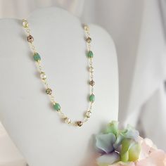 "This handcrafted green aventurine beaded necklace is a unique piece that makes a memorable green gemstone jewelry gift for her. It is sold as a 3-piece set of 3-inch long earrings, an adjustable 18-20 inch necklace and a matching 6.5-8 inch bracelet. The earrings are made with 14K gold-filled 20-gauge French earwires, and the necklace and bracelet are made with our anti-tarnish treated gold wire, chain and lobster clasps.  The beads used in this elaborate design are 8mm and 12mm vintage cloisonne beads, genuine 8x13mm green aventurine oval beads and 8mm white shell pearls. Thank you for visiting Gemsicles!  - Shop Gemsicles, an Etsy boutique with hundreds of sparkly items for weddings, gifts and just because. Our original jewelry designs feature gemstones, Discontinued Designer crystals, Elegant Amazonite Bead Necklaces, Elegant Amazonite Gemstone Beaded Necklace, Elegant Amazonite Beaded Necklace, Gold Aventurine Beaded Jewelry, Green Jade Beaded Chain Jewelry, Green Jade Jewelry With Beaded Chain, Green Agate Jewelry With Faceted Beads, Jade Necklaces With Natural Stones For May Birthstone, Elegant Chrysoprase Gemstone Beads Necklaces