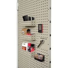 there are many items on the pegboard attached to the wall