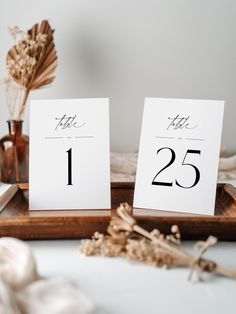 the table numbers are displayed on wooden trays