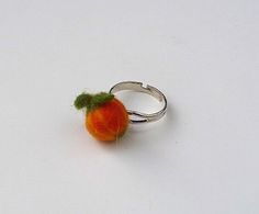 This sweet pumpkin ring shines in beautiful orange-green tones, the colors of autumn. So it fits very well with every autumn wardrobe. You can also wear it for a Halloween party or a carnival ball. The pumpkin is very fine and yet robust, so you can enjoy it for a long time. Of course, the ring comes in a nice gift wrap to your home. **Material Sheep's wool, ring made of nickel-free metal silver plated, the ring rail is adjustable in size. ** Manufactured: ** With a lot of love dry and wet felte Pumpkin Ring, Colors Of Autumn, Silver Gift Wrap, Sweet Pumpkin, Autumn Wardrobe, Bridesmaid Gifts Jewelry, Green Tones, Fete Halloween, Silver Gifts