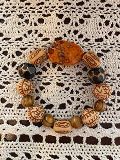 Fall Color Bracelet Set.  Orange, Brown and Black Bracelet Set.   Perfect for Fall. Brown Hand Wrapped Stretch Bracelet For Gift, Brown Hand Wrapped Stretch Bracelet Gift, Brown Beaded Bangle Bracelet For Gift, Unique Orange Adjustable Bracelet, Unique Adjustable Orange Bracelet, Bohemian Brown Wristlet For Gift, Unique Adjustable Orange Bracelets, Handmade Bohemian Brown Wristband, Bohemian Round Stretch Bracelet For Beach