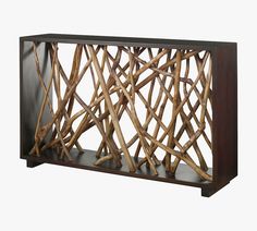 a wooden shelf that has some branches on it and is made out of dark wood