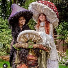 two women dressed up as witches standing next to each other