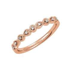 a rose gold wedding band with diamonds