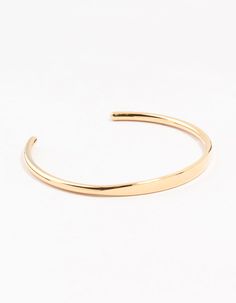 Upgrade your everyday style with our durable cuff bracelet, crafted from water-resistant gold-plated stainless steel. Its sleek, classic design ensures long-lasting elegance, ideal for effortless sophistication in any setting. Material: Gold Plated, Stainless Steel Color: Gold Dimensions: Diameter: 5.5 cm Length: 18 cm - Stretch Fit Width: 5 mm Waterproof/Resistant: Waterproof pieces from this collection are crafted from stainless steel, meaning they're sweat, swim and shower proof! This piece f Classic Matte Gold Bracelet, Adjustable Gold-tone Classic Cuff Bracelet, Classic Adjustable Gold-tone Cuff Bracelet, Classic Gold Bangle For Everyday, Classic Gold-tone Bangle For Everyday, Classic Adjustable Open Cuff Bangle, Everyday Gold Cuff Bracelet, Classic Gold Cuff Bracelet, Sleek Adjustable Gold Jewelry