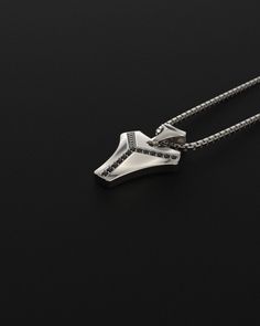 This magnificent pendant is composed of 18k white gold, includes 16 black diamonds and is completely handmade. A talisman stone is for those who want to know what life is all about. It will bring out all of your great qualities. The vertebrae that make up the human spine influenced its design. On a psychological level, this diamond represents what gives man the fortitude, bravery, drive, and unwavering belief to achieve his goals.Many people like white gold because of its silvery white hue, which gives it a refined appearance while also making it considerably more expensive than silver.White gold is impervious to rust, tarnish, and corrosion. White gold is more durable than yellow gold because it is alloyed with a combination of harder metals. Made entirely by hand with all the love and ar Luxury Black Diamond Pendant Necklace, Luxury Black Spinel Silver Jewelry, Black Diamond Pendant Jewelry Gift, Sterling Silver Black Diamond Pendant Necklace, Sterling Silver Pendant Necklace With Black Diamonds, Minimalist Silver Jewelry With Black Diamonds, Modern Sterling Silver Jewelry With Black Diamonds, White Gold Necklace With Black Diamonds For Gift, Human Spine