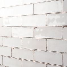 a white brick wall with no mortars on it