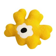 a yellow and white flower shaped animal toy on a white background with black dots in the center